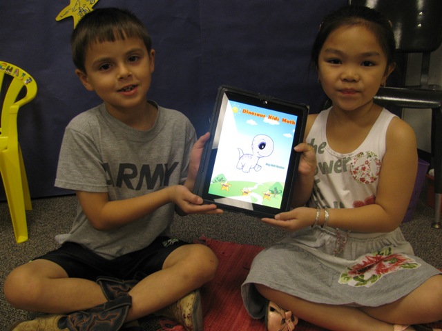 First Graders showing iPads